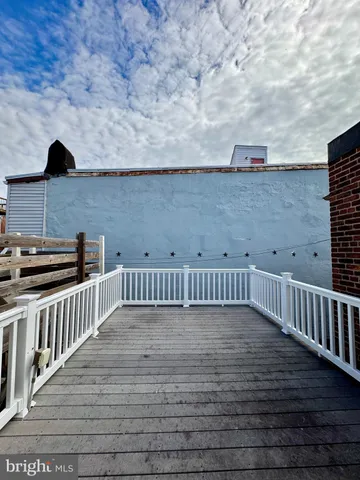 an empty room with wooden floor and closet