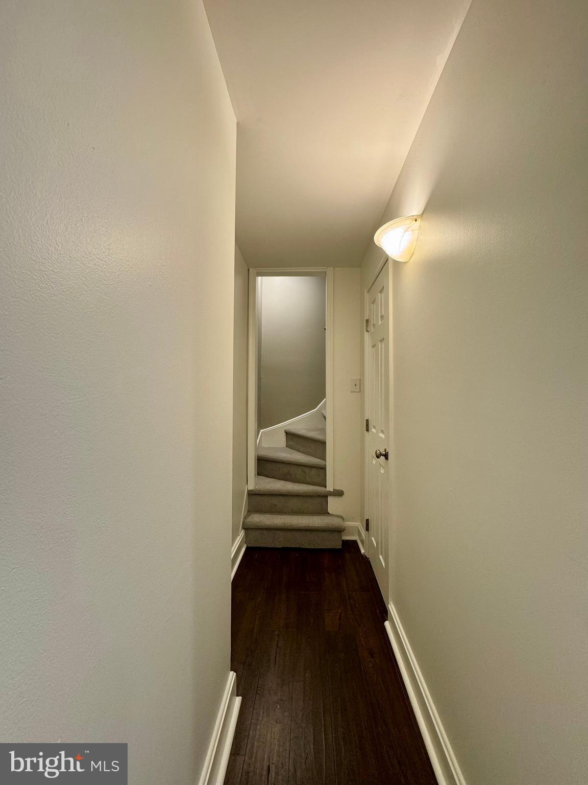 1313 Patapsco Street Baltimore, MD 21230 - Photo 6 of 20 a view of a hallway with wooden floor and staircase