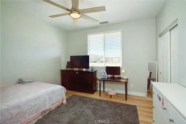 a bedroom with a workspace