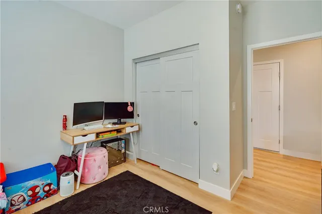 a room with furniture and wooden floor