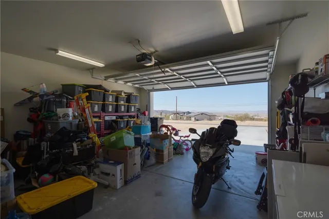 a living room with lots of furniture and clothes