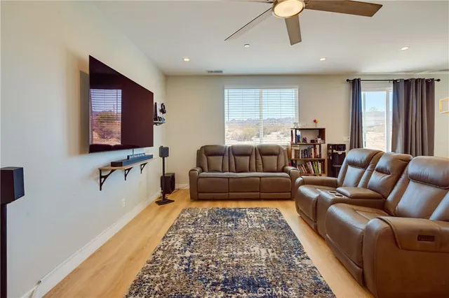 a living room with furniture and a rug