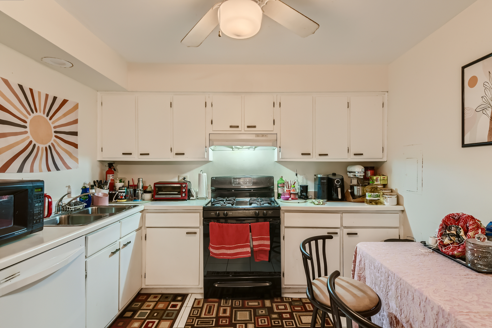 1133 South Finley Road, Unit 101 Lombard, IL 60148 - Photo 16 of 24 a kitchen with granite countertop a stove sink and cabinets