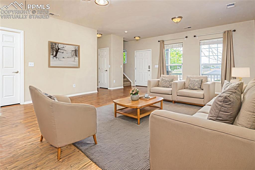 4815 Harrier Ridge Drive Colorado Springs, CO 80916 - Photo 6 of 33 Living area with light wood-style flooring and baseboards Virtually Staged