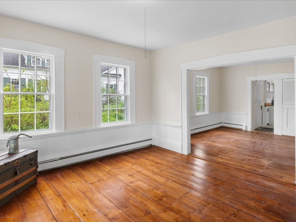 5 Northeast Fitzwilliam Road Royalston, MA 01368 - Photo 13 of 37 an empty room with wooden floor and windows