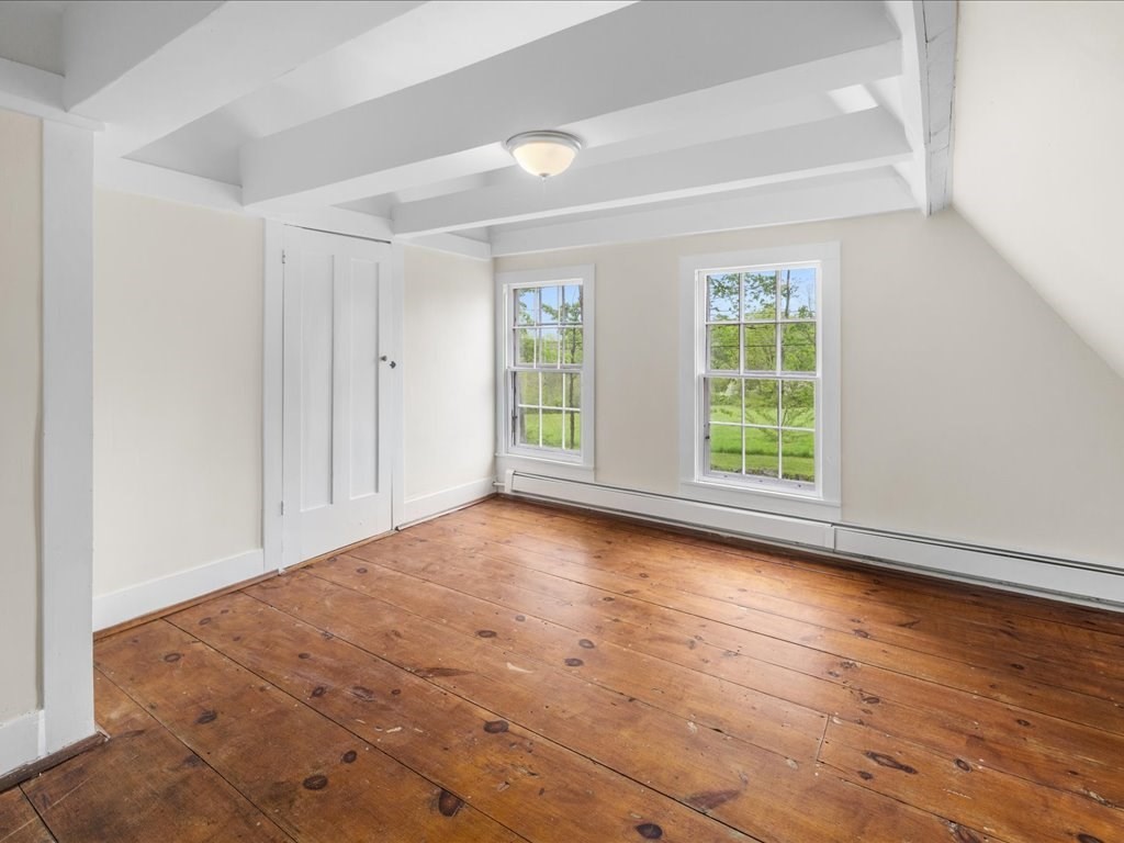 5 Northeast Fitzwilliam Road Royalston, MA 01368 - Photo 30 of 37 an empty room with wooden floor and windows
