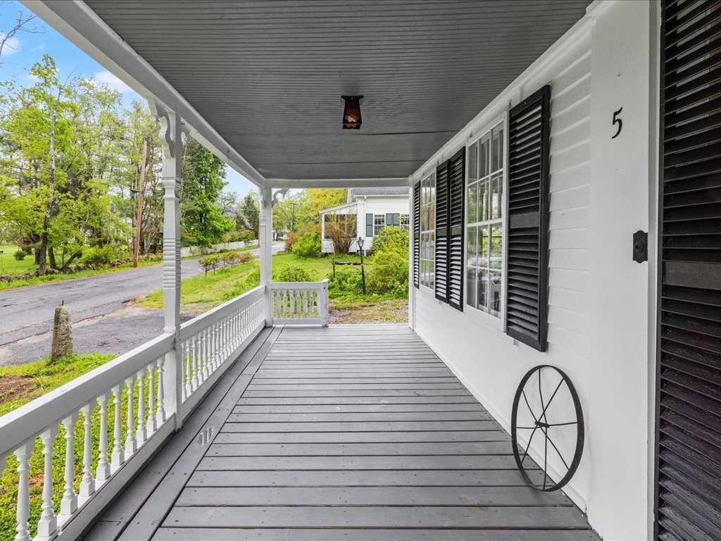 5 Northeast Fitzwilliam Road Royalston, MA 01368 - Photo 8 of 37 a view of a porch with wooden floor and fence
