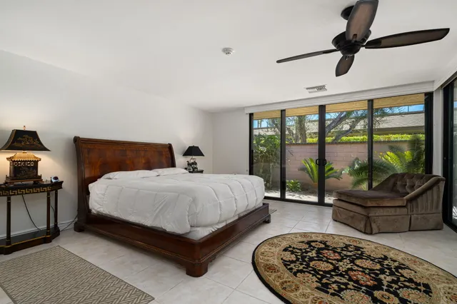 a bedroom with a large bed and a couch