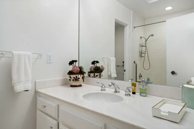 a bathroom with a double vanity sink mirror and double