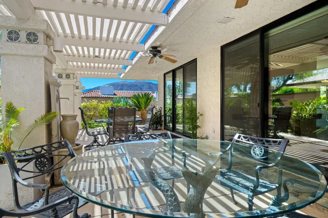 a view of swimming pool with outdoor seating