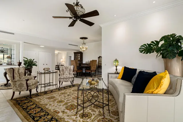 a living room with furniture and a rug