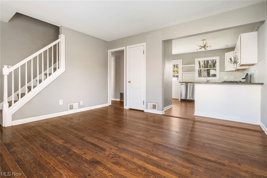 1612 Garman Road Akron, OH 44313 - Photo 7 of 18 Unfurnished living room with dark hardwood / wood-style flooring