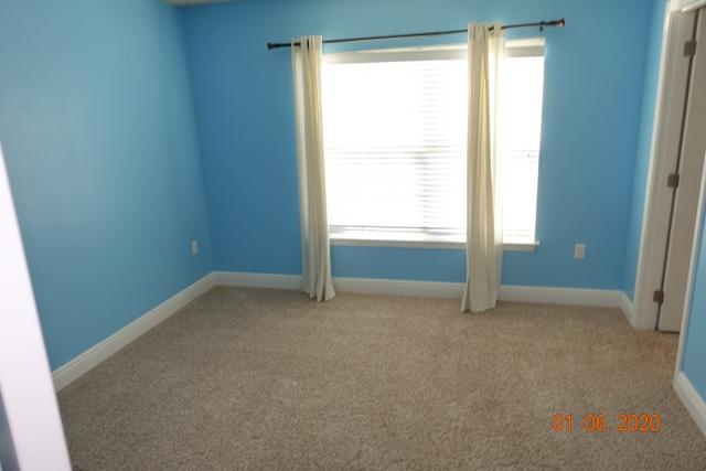 66 Pin Oak Loop Santa Rosa Beach, FL 32459 - Photo 16 of 32 a view of an empty room with a window