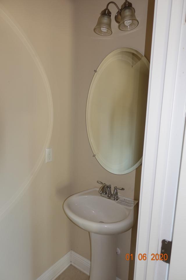 66 Pin Oak Loop Santa Rosa Beach, FL 32459 - Photo 19 of 32 a bathroom with a sink and a mirror