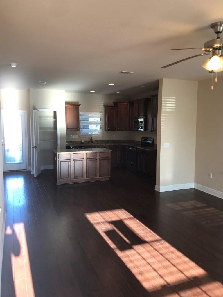 66 Pin Oak Loop Santa Rosa Beach, FL 32459 - Photo 2 of 32 a kitchen with stainless steel appliances granite countertop a refrigerator and a stove