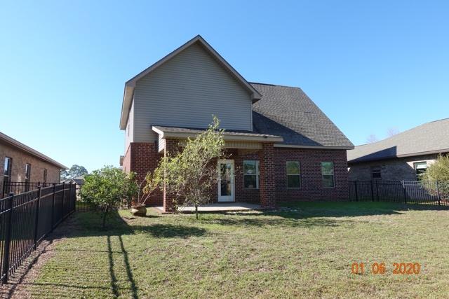 66 Pin Oak Loop Santa Rosa Beach, FL 32459 - Photo 28 of 32 a front view of a house with a yard