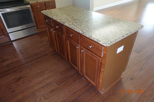 66 Pin Oak Loop Santa Rosa Beach, FL 32459 - Photo 6 of 32 a kitchen with wooden cabinets and a sink