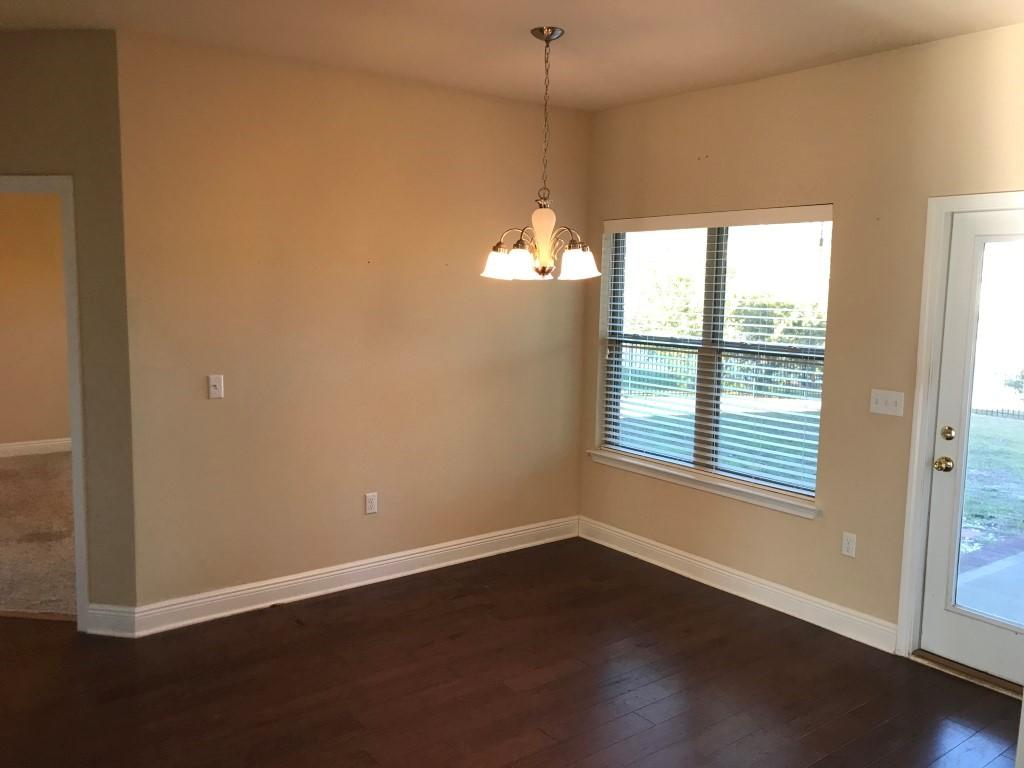 66 Pin Oak Loop Santa Rosa Beach, FL 32459 - Photo 9 of 32 an empty room with wooden floor and windows