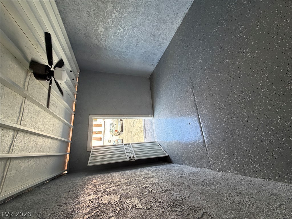 2236 East Desert Inn Road Las Vegas, NV 89169 - Photo 29 of 34 A well-maintained garage with durable concrete flooring and efficient overhead lighting.