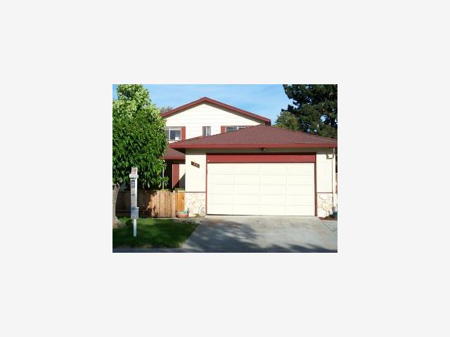 a picture of a bench in front of a building