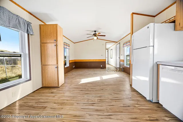 a view of hallway with stairs and wooden floor