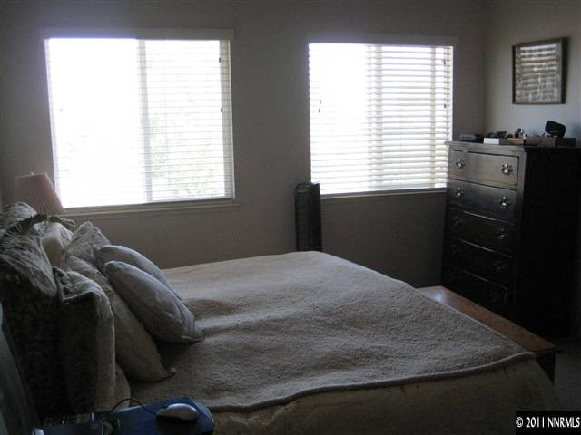 2265 Snowmass Drive Reno, NV 89511 - Photo 11 of 13 a bedroom with a bed and a window