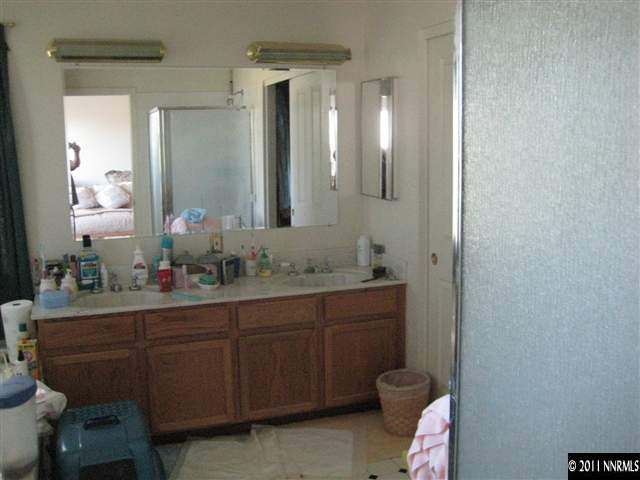 2265 Snowmass Drive Reno, NV 89511 - Photo 12 of 13 a bathroom with a toilet sink and mirror