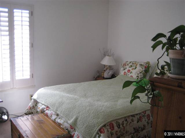2265 Snowmass Drive Reno, NV 89511 - Photo 13 of 13 a bedroom with a bed and a window in it