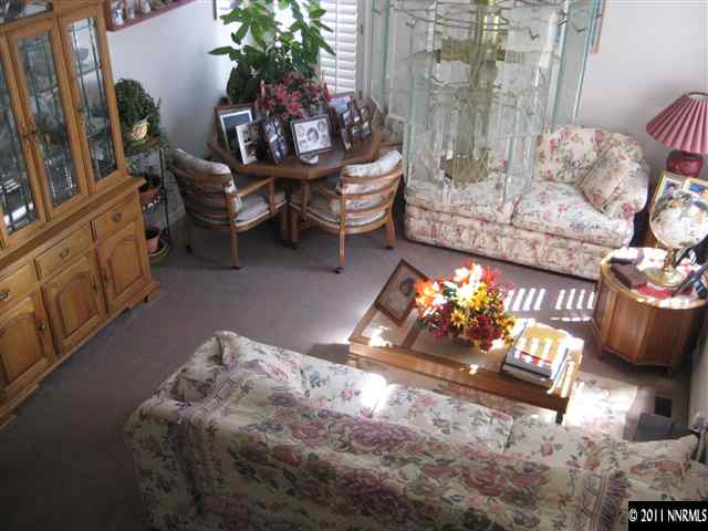 2265 Snowmass Drive Reno, NV 89511 - Photo 9 of 13 a living room with furniture and a fireplace