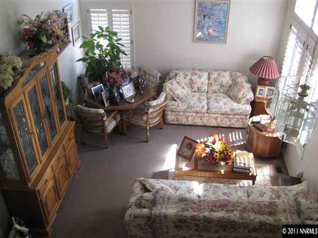 2265 Snowmass Drive Reno, NV 89511 - Photo 10 of 13 a living room with furniture flowerpot and a chandelier