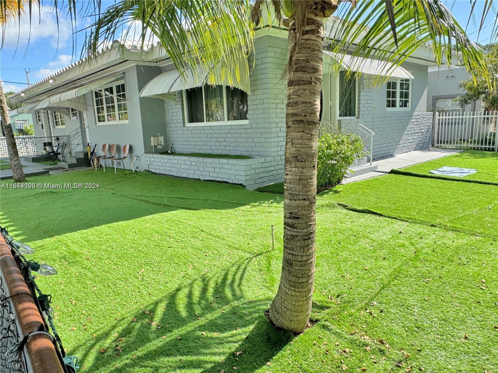 501 Northeast 70th Street, Unit 3 Miami, FL 33138 - Photo 1 of 11 a view of a house with a backyard