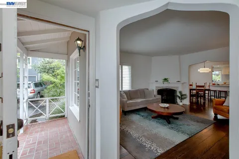 a living room with furniture a rug and a fireplace