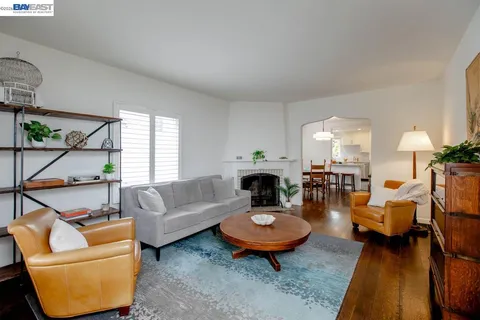 a living room with furniture and a table