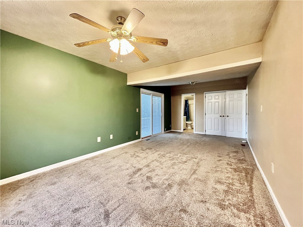 4214 School House Road Little Hocking, OH 45742 - Photo 15 of 29 Carpeted empty room featuring ceiling fan and a textured ceiling
