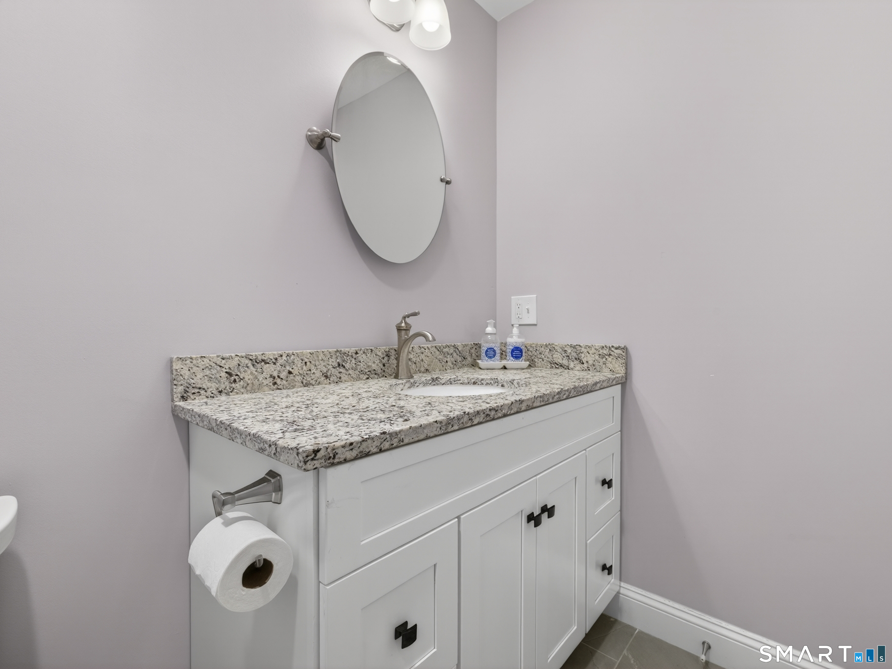 34 Village Crossing, Unit 34 Niantic, CT 06357 - Photo 29 of 38 a bathroom with a granite countertop sink and a mirror
