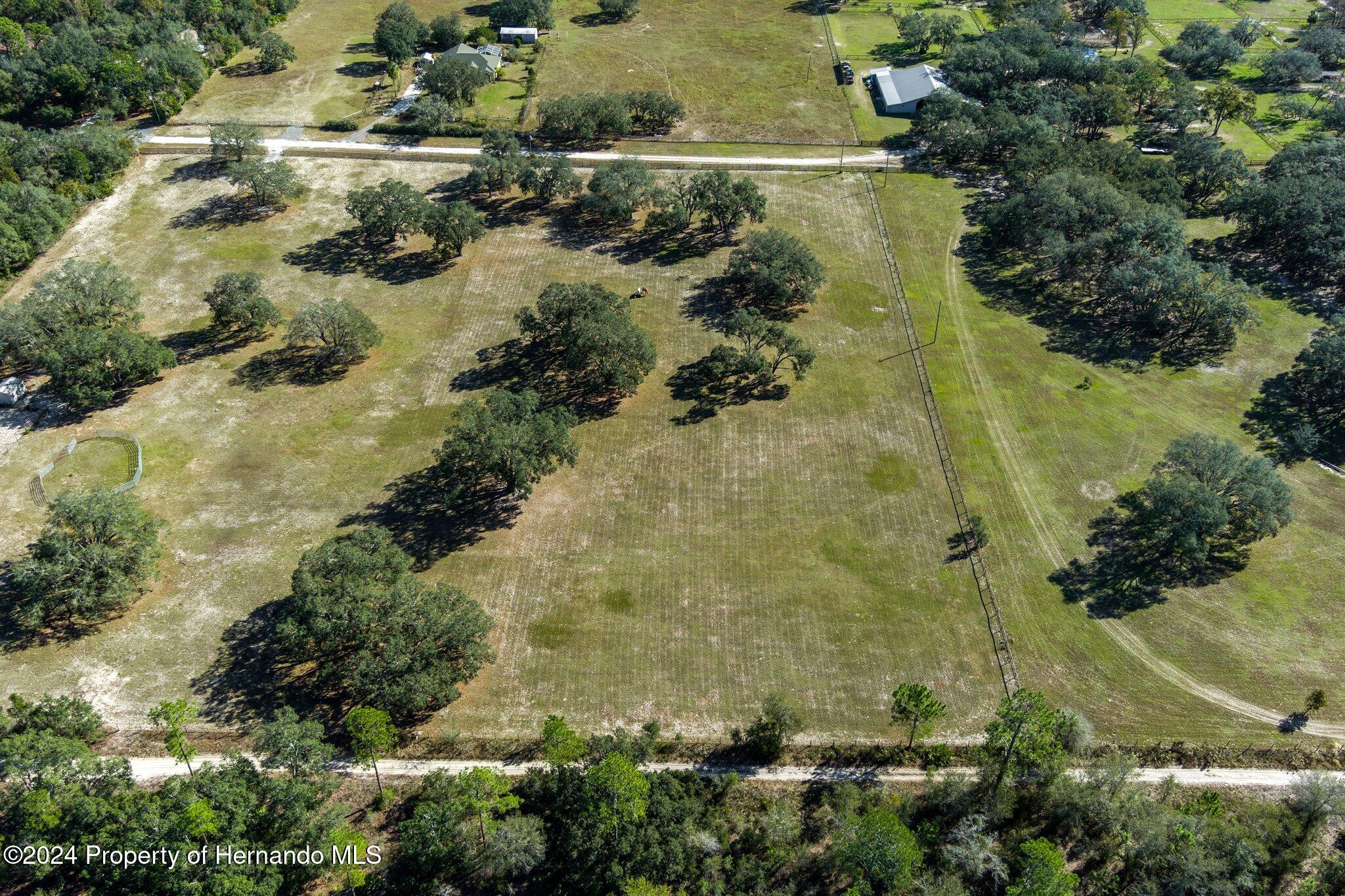 13383 Hurricane Drive Weeki Wachee, FL 34614 - Photo 12 of 18 an aerial view of residential house with outdoor space