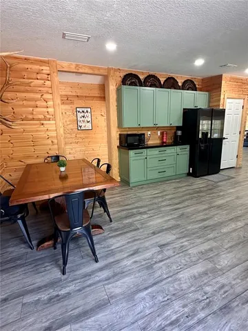 a view of front door and wooden floor