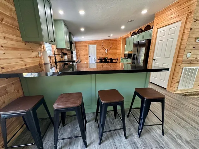 a living room with fireplace furniture and a flat screen tv