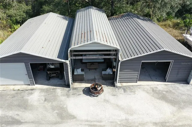 a outdoor living space with patio furniture and a fireplace