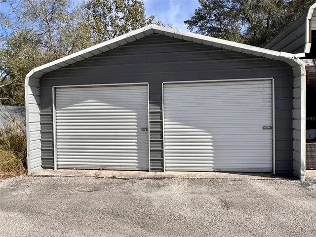 a view of a yard with a tree