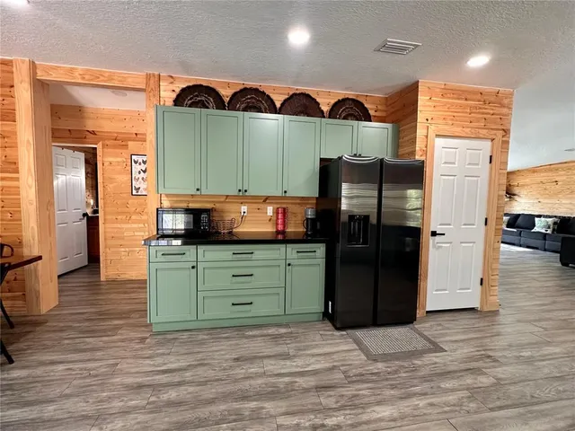 a dining room with furniture and wooden floor