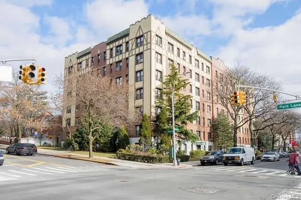 a front view of a building with street view