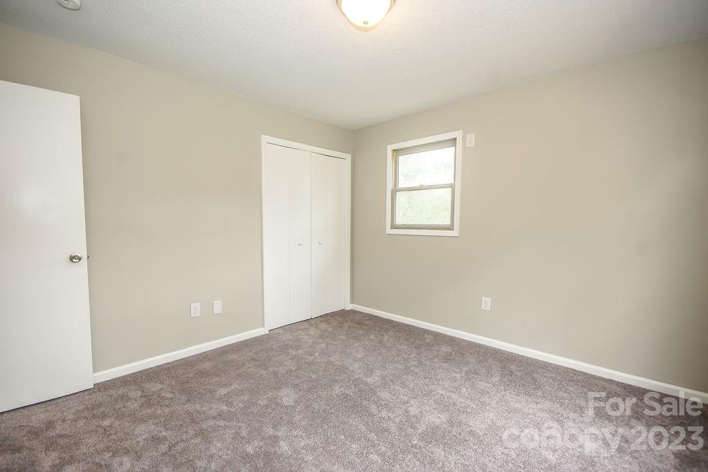 8998 Mt Olive Road Mount Pleasant, NC 28124 - Photo 11 of 15 an empty room with windows
