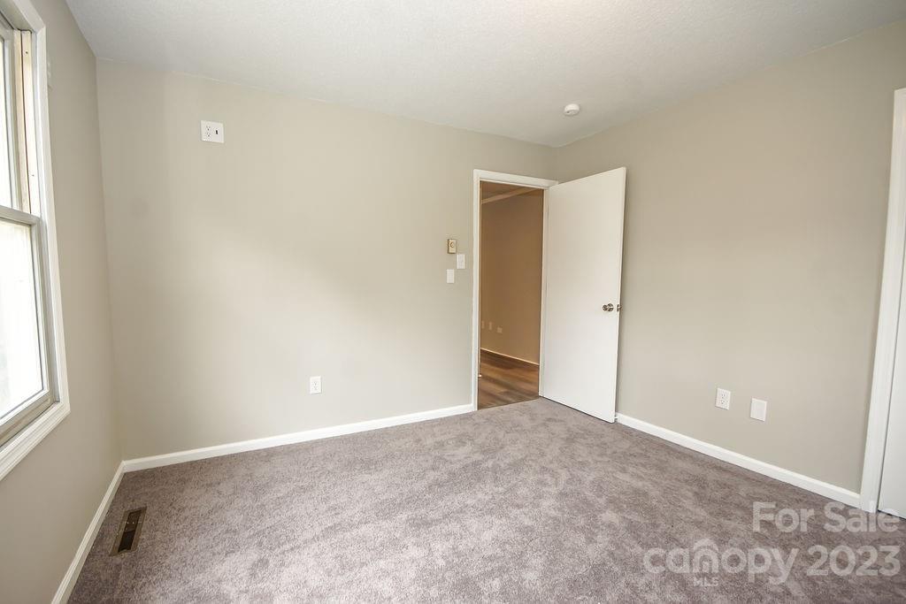 8998 Mt Olive Road Mount Pleasant, NC 28124 - Photo 12 of 15 an empty room with windows and closet