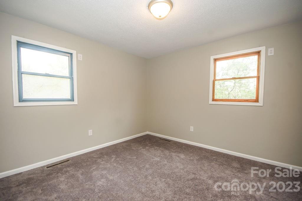 8998 Mt Olive Road Mount Pleasant, NC 28124 - Photo 13 of 15 an empty room with a window