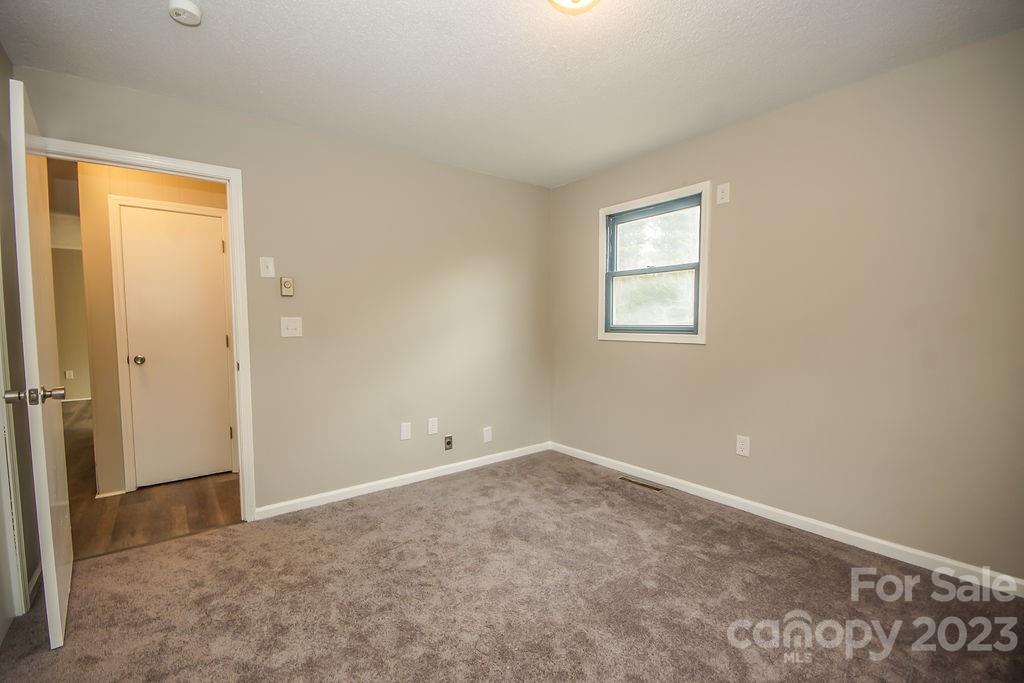 8998 Mt Olive Road Mount Pleasant, NC 28124 - Photo 14 of 15 an empty room with a window