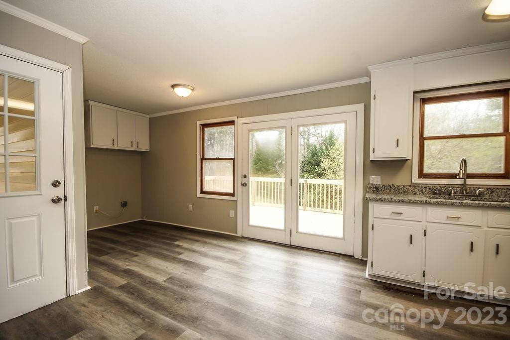 8998 Mt Olive Road Mount Pleasant, NC 28124 - Photo 7 of 15 a view of an empty room with a window and wooden floor