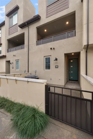 a kitchen with stainless steel appliances a sink and a microwave