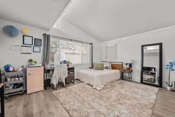 a bed room with furniture and a window