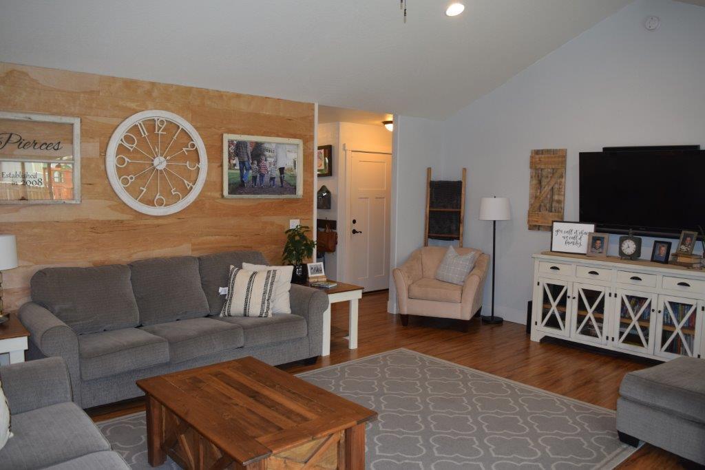 906 Win Way Eagle Point, OR 97524 - Photo 17 of 33 a living room with furniture and a flat screen tv
